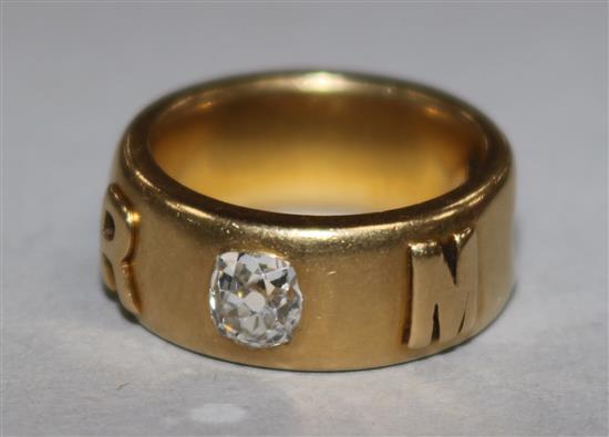 An 18ct gold and diamond memorial ring, 12 grams gross